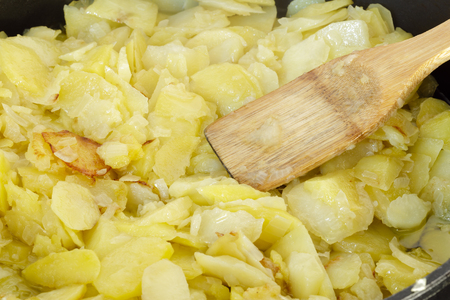 Preparing a traditional spanish omelette close up. Spanish cuisine. Spanish Tortilla の写真素材