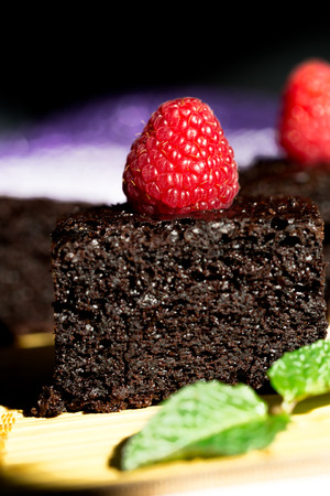 Close up of Dark chocolate cake with raspberriesの写真素材