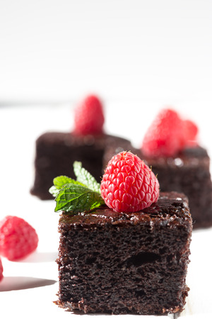 Dark chocolate cake with raspberriesの写真素材