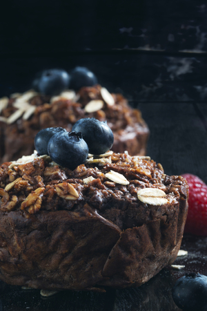 Close up of Healthy Blueberry muffins on rustic table.の写真素材