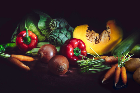 Healthy food concept with fresh vegetables on dark background. Rustic style.の写真素材