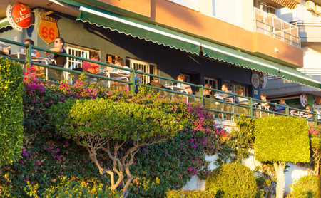 ROTA, SPAIN - SEPTEMBER 09, 2016:  Rota Beach. People enjoying the sunset on a terrace bar. Rota, Cadiz ,Spain.のeditorial素材