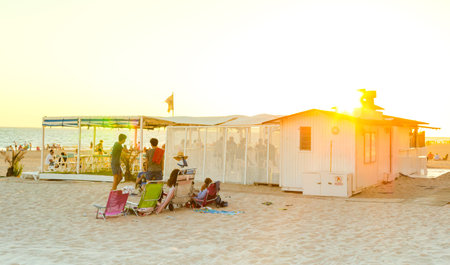 ROTA, SPAIN - SEPTEMBER 09, 2016:  Rota Beach. Young people enjoying the beach at sunset. Rota, Cadiz.のeditorial素材