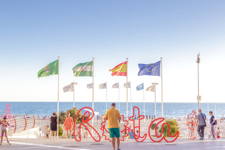ROTA, SPAIN - SEPTEMBER 09, 2016:  Rota Beach.  People walking along the promenade. Rota, Cadiz, Spainのeditorial素材