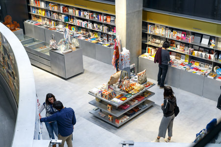 Seville, Spain - April 02, 2017: People reading and shopping at new cultural center of the Isla de...