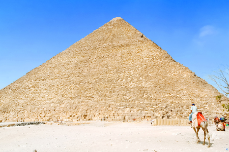 Camel guide wait for tourists at the pyramidsの写真素材