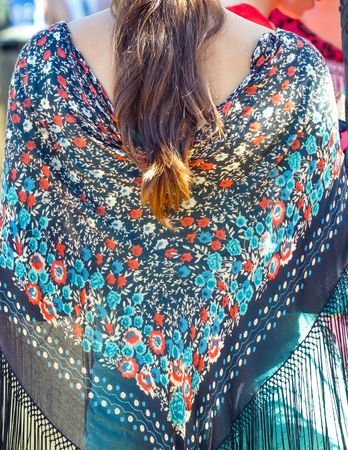 Woman wearing colorful flamenco dress. 