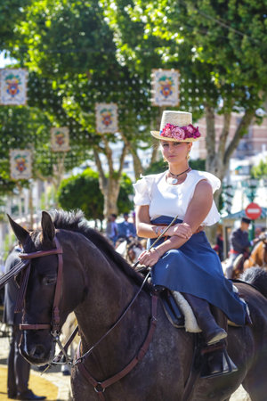Seville, Spain - May 02, 2017: Beautiful woman riding horses at the Seville's April Fair.のeditorial素材