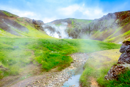 Green valley of the South Iceland wtih natural hot springs and steam . Reykjadalur Valley. Iceland, Europe.の写真素材