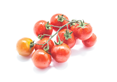 Bunch of cherry tomatoes isolated on white backgroundの写真素材