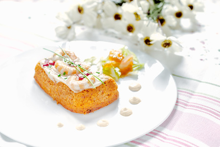 Traditional Spanish fish cake. Hake cake with tomato, shrimps and salad cream.の写真素材