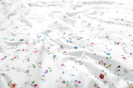 Soft white bed sheets background.の写真素材