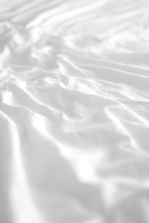 White bed sheets backgroundの写真素材