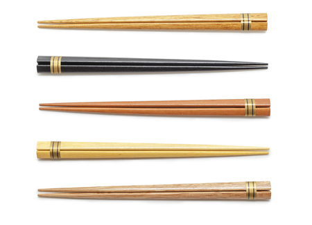 Elegant collection wooden chopsticks isolated on white backgroundの写真素材