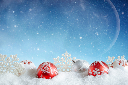 Christmas Card. Red and white bubbles and snowflakes in winter setting.の写真素材
