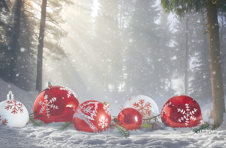 Christmas magic winter Scene. Red and white bubbles in snowy forest landscape.の写真素材