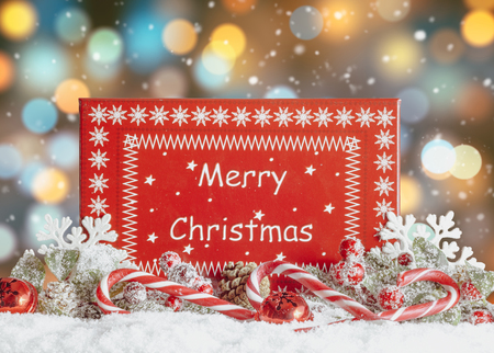 Christmas Gift Box and Decorations on snow bokeh bakground. Merry Christmas and Happy New Yearの写真素材