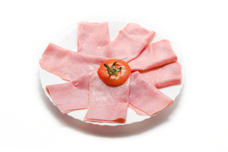 Dish with slices of york ham isolated on white background. の写真素材