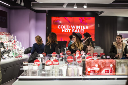 Seville, Spain - January 13, 2018: Women shopping. Women in the sales looking at cosmetics store. Twice a year in Spain shoppers are treated to an end-of-season sale period, called las rebajas, in which goods can be purchased at a significant discount.のeditorial素材