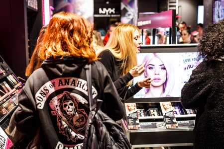 Seville, Spain - January 13, 2018: Women shopping. Women in the sales looking at cosmetics store. Twice a year in Spain shoppers are treated to an end-of-season sale period, called las rebajas, in which goods can be purchased at a significant discount.のeditorial素材