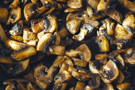 Delicious and healthy fried Mushroom champignon with olive oil, onion, garlic and chilli.の写真素材