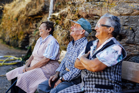 Orense, Spain - August 21, 2016: Older Galician people dedicated to work in the field talking happily in the province of Orense, Galicia. Spain. Traditionally, Galicia depended mainly on agriculture and fishing. Galicia was based on a farming and fishing のeditorial素材