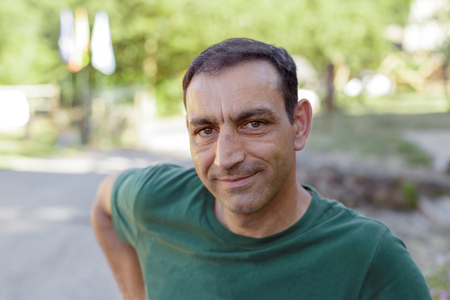 Portrait of handsome Man looking to camera outdoor.の写真素材