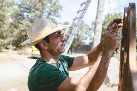 Portrait of young man working outdoorsの写真素材