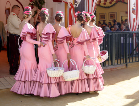 Seville, Spain - May 03, 2017:  Beautiful andalusian young women posing and dressed in traditional costumes at the Seville's April Fair.のeditorial素材