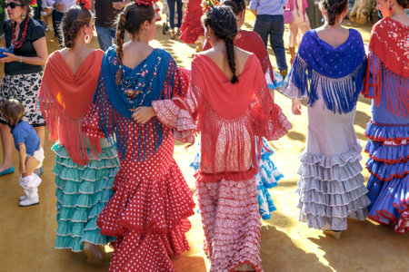 Seville, Spain - May 03, 2017:  Young Women dressed in traditional costumes at the Seville's April Fair.のeditorial素材
