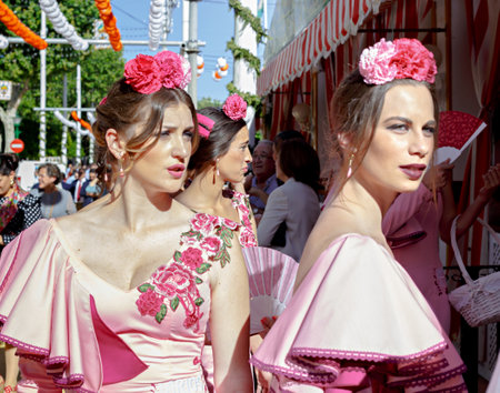 Seville, Spain - May 03, 2017:  Portrait of  attractive Women dressed in traditional costumes at the Seville's April Fair.のeditorial素材