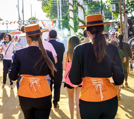 Seville, Spain - May 03, 2017:  Young Women dressed in traditional costumes at the Seville's April Fair.のeditorial素材