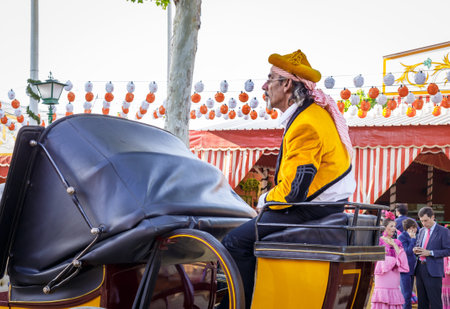 Seville, Spain - May 03, 2017: Traditional riding horse carriage celebrating Seville's April Fair.のeditorial素材
