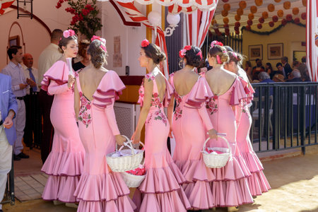 Seville, Spain - May 03, 2017:  Beautiful andalusian young women dressed in traditional costumes at the Seville's April Fair.のeditorial素材
