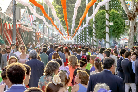 Seville, Spain - May 03, 2017: Crowd of people of all ages having fun and taking a walk at the Seville's April Fair.のeditorial素材