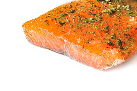 Homemade smoked and marinated salmon with dill on white dish. Healthy food and source of omega 3.の写真素材
