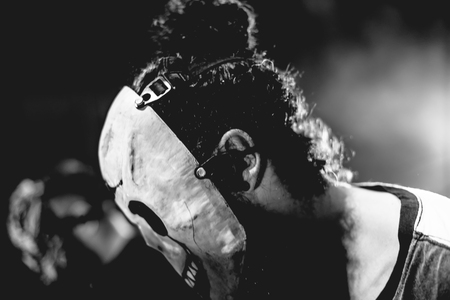 DJ with Skull mask playing electronic music at Summer Party Festival. Fun, youth, entertainment and fest concept.の写真素材