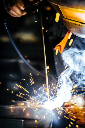 Industrial Worker at the factory welding closeup. Selective focus.の写真素材