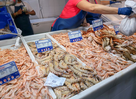 Fresh seafood on ice at the fish market. Isla Crsitina market, Huelva, Spainの写真素材