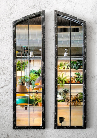 Frame with mirror on white wall painted with reflection of beautiful interior design.の写真素材