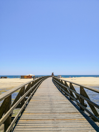 Wooden bridge and Isla Cristina beach, Costa de la Luz, Huelva, Spainの写真素材