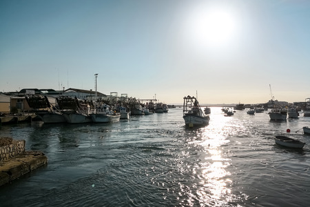 Fishing port at sunset, beautiful fishing village. Isla Cristina, Huelva, province of Andalusia, Spain.の写真素材