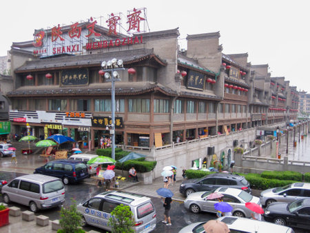 Xian, China - July 09, 2010: Traffic in the city of Xian in a Rainy day . Street scene of xian in the center of ancient city, Chinaのeditorial素材