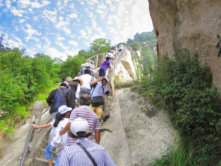 Huangshan, China - July 11, 2010: Tourists visit the famous Huangshan mountain. Mountain Huangshan is World cultural and natural heritage. It is one of the chief tourist attractions in China.のeditorial素材