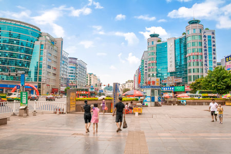 Guilin, China - July 13, 2010: Traffic and pedestrians in Guilin Boulevard. Commercial and business street scene. Guilin. China.のeditorial素材