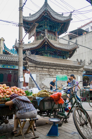 Xian, China - July 12, 2010: Muslim Street in Xian. The main food street area is known as Huimin Street or Muslim Quarter. Hui people are a muslim ethnic minority in Xian. Beiyuanmen Moslem Street, Muslim Quarters, Xian China.のeditorial素材