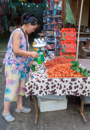 Xian, China - July 12, 2010: Muslim Street in Xian. The main food street area is known as Huimin Street or Muslim Quarter. Hui people are a muslim ethnic minority in Xian. Beiyuanmen Moslem Street, Muslim Quarters, Xian China.のeditorial素材