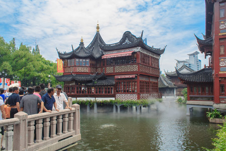 Shanghai, China - July 18, 2010: Tourists visit Yuyuan garden (Garden of Happiness). Yu Garden is an...