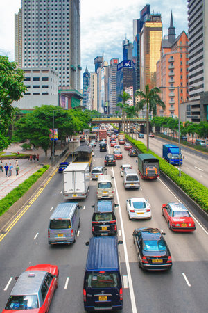 Hong Kong, China - July 20, 2010: Traffic, modern office buildings and city life In Hong Kong. Hong Kong is one of the most populated areas in the world and one of the world's leading international financial centres.のeditorial素材