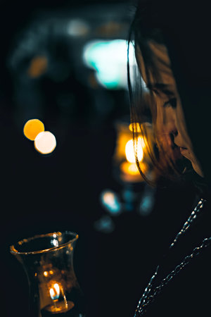 Zamora, Spain - March 31, 2018: Ladies of the Virgin of Solitude during holy week (semana santa) in Zamora, Spain. The ladies wear rigorous mourning, with a black cloak with a cap, with a distinctive medal and with a glass tulip.のeditorial素材